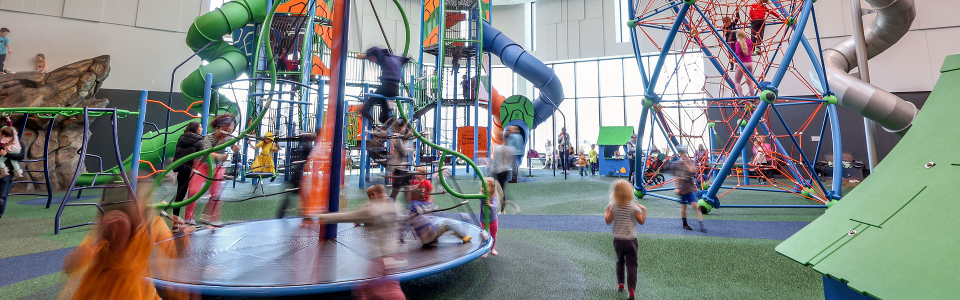 People playing in the K.U.B.E. Indoor Playground at the Plymouth Community Center