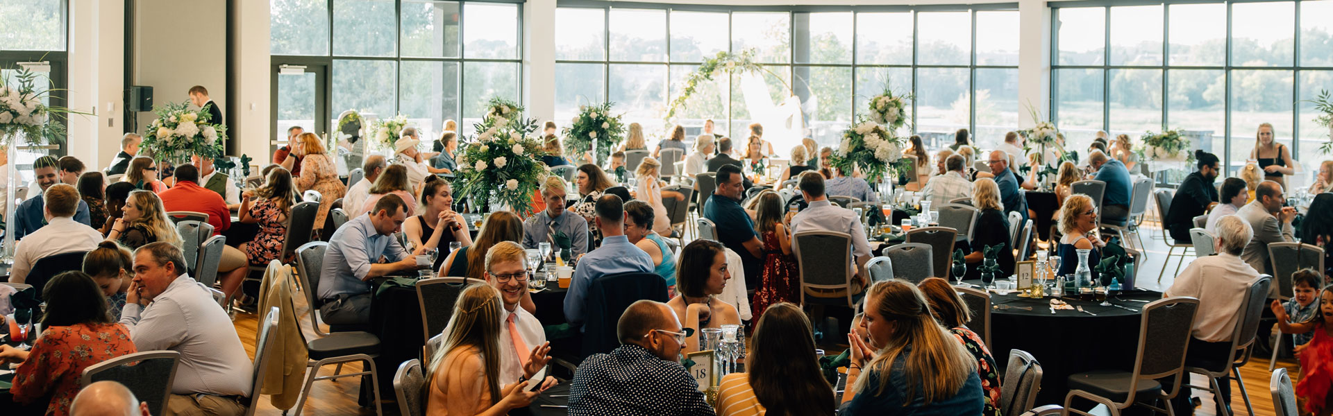 People at a wedding at the Plymouth Community Center. Photo credit: lullephoto